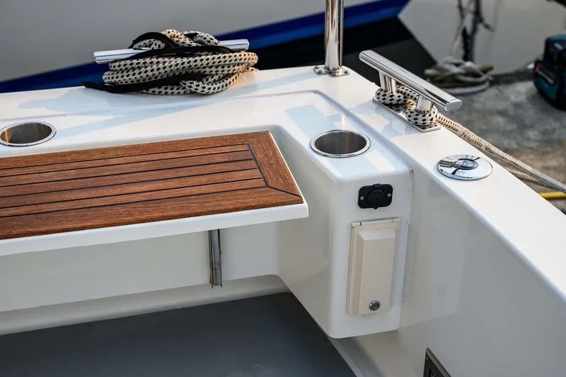 Slide: The Image of 2019 Targa 35 boat deck with wooden trim and mooring cleats. - 56