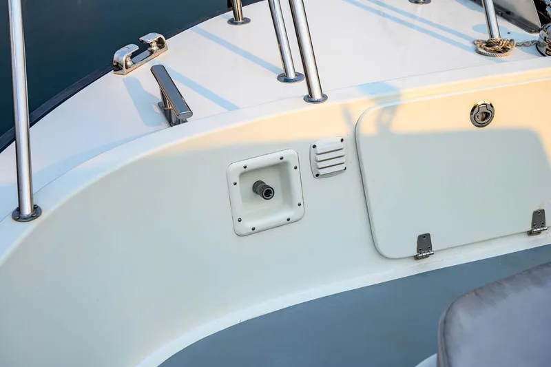 Slide: The Image of 2019 Targa 35 boat deck with railing and storage compartment. - 60