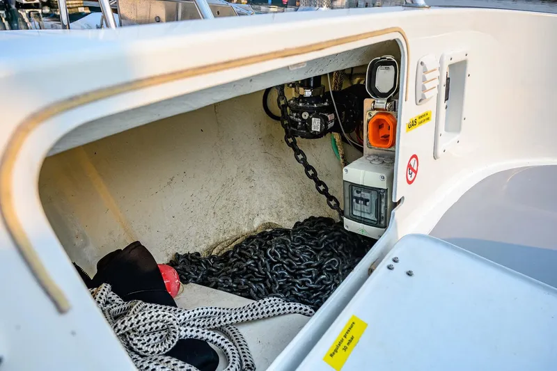 Slide: The Image of Storage compartment of a 2019 Targa 35 boat with chains and ropes. - 62
