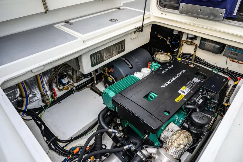 Slide: The Image of Engine compartment of a 2019 Targa 35 boat featuring a Volvo Penta IPS 400 engine. - 64