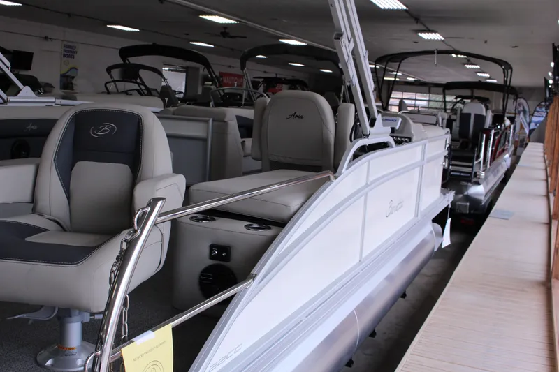 Slide: The Image of 2024 Barletta Aria 22CC pontoon boat displayed in a showroom. - 10