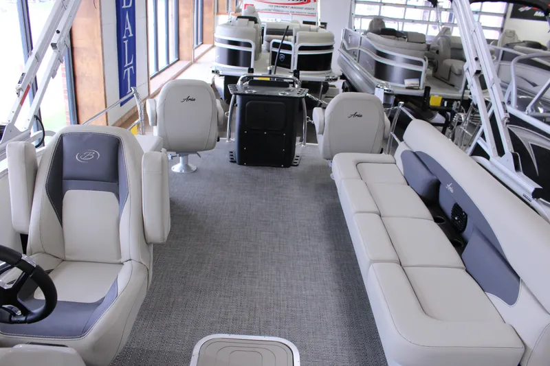 Slide: The Image of 2024 Barletta Aria 22CC pontoon boat interior with plush seating and modern design. - 11