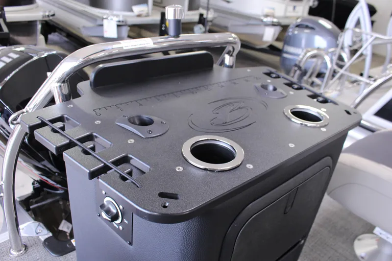 Slide: The Image of 2024 Barletta Aria 22CC boat console with cup holders and control panel. - 12