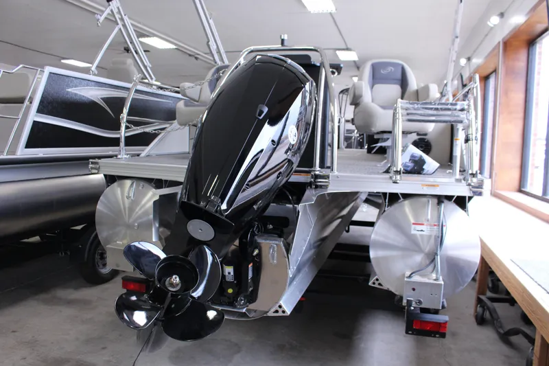 Slide: The Image of 2024 Barletta Aria 22CC pontoon boat with powerful outboard motor in showroom. - 13