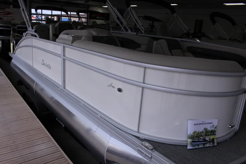 Slide: The Image of 2024 Barletta Aria 22CC pontoon boat displayed in a showroom. - 3