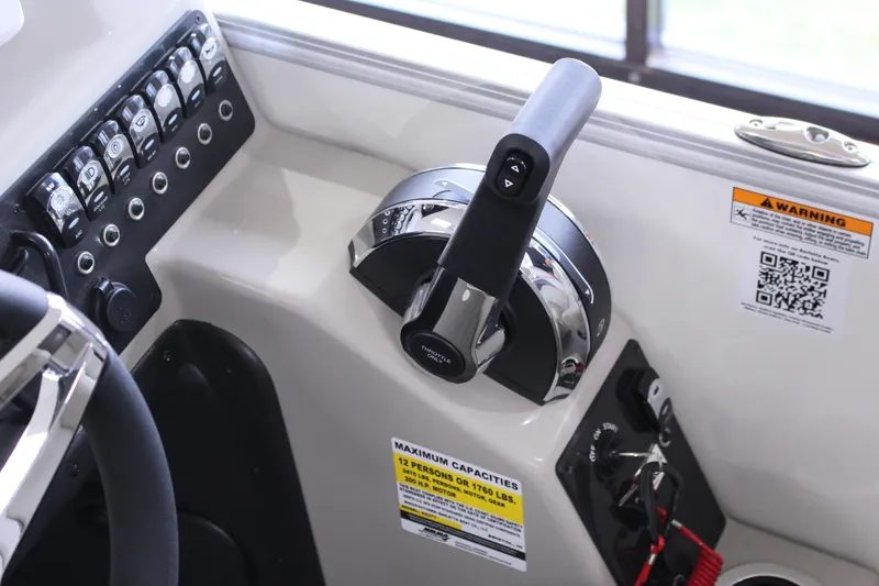 Slide: The Image of 2024 Barletta Aria 22CC boat control panel with throttle and switches. - 6