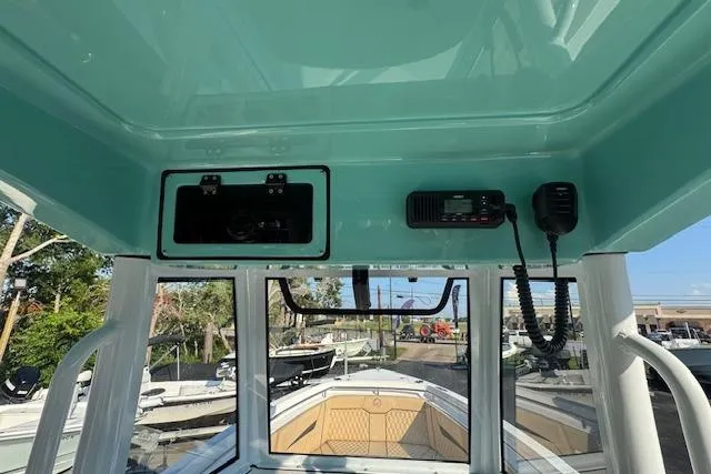 Slide: The Image of Interior view of 2025 Drakkar 280CC boat cockpit with communication equipment. - 14