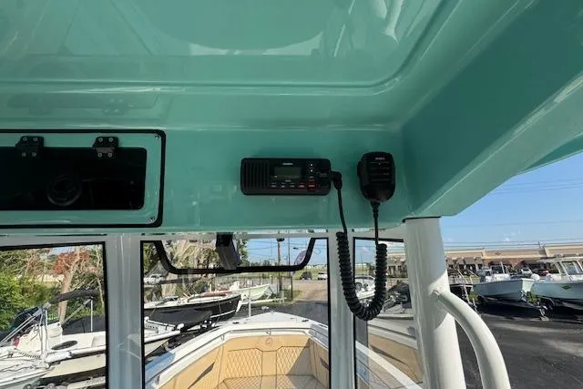 Slide: The Image of Interior view of 2025 Drakkar 280CC boat with radio equipment. - 15