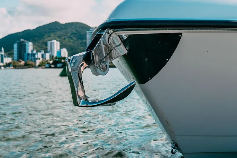 Slide: The Image of Bow of 2025 Drakkar 280CC boat with cityscape and mountains in background. - 26