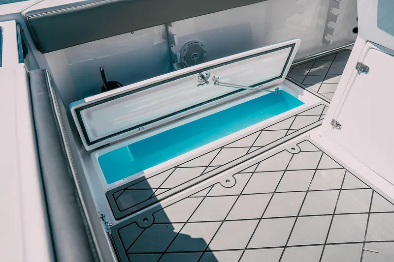 Slide: The Image of 2025 Drakkar 280CC boat storage compartment with open hatch and modern flooring design. - 31