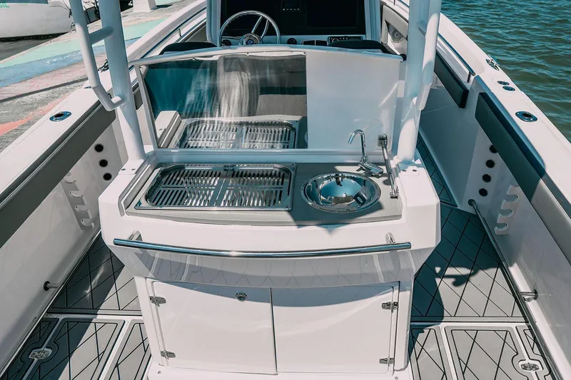 Slide: The Image of 2025 Drakkar 280CC boat interior with modern kitchen and sleek design. - 32