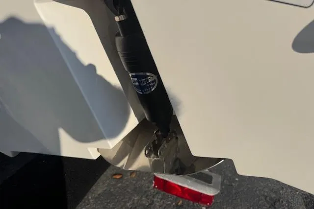 Slide: The Image of Close-up of 2025 Drakkar 280CC boat's trim tab and hydraulic system. - 33