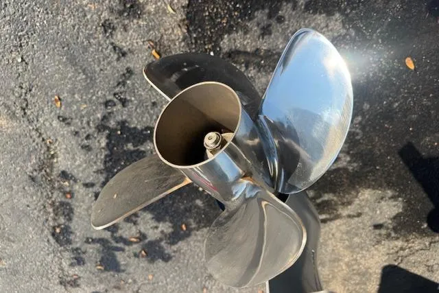 Slide: The Image of Shiny propeller of 2025 Drakkar 280CC boat on asphalt surface. - 5