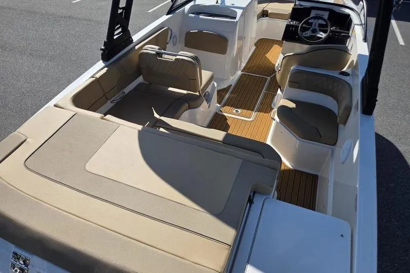Slide: The Image of 2025 Bayliner VR6 OB boat interior with spacious seating and modern design. - 7