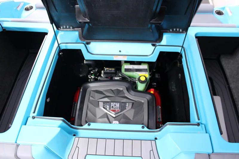 Slide: The Image of 2023 Nautique G25 engine compartment with PCM engine, open hatch view. - 14