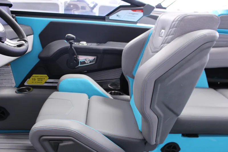 Slide: The Image of 2023 Nautique G25 interior with modern steering and seating design. - 7