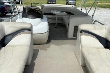 Slide: The Image of 2005 Sun Tracker PB 22 R pontoon boat interior with spacious seating and table. - 3