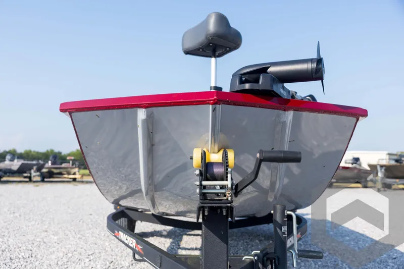Slide: The Image of 2022 Tracker Pro 170 boat on trailer, front view, red and silver design. - 13