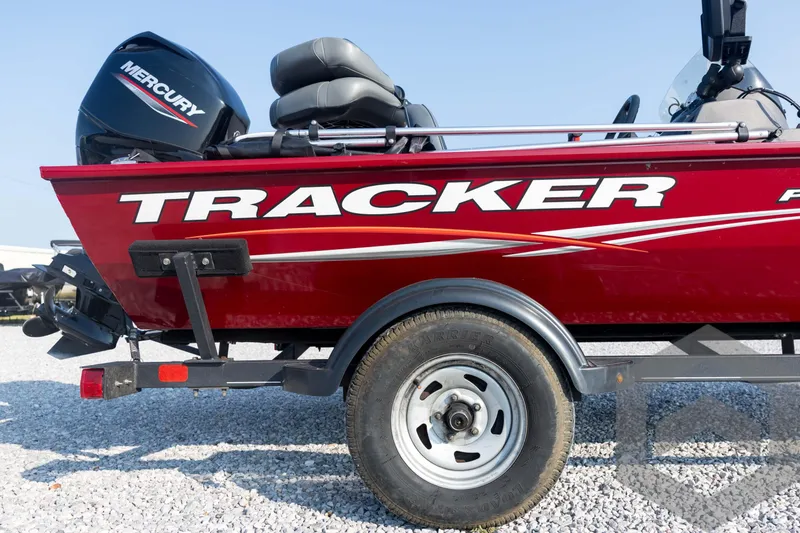 Slide: The Image of Red 2022 Tracker Pro 170 boat with Mercury engine on a trailer. - 18