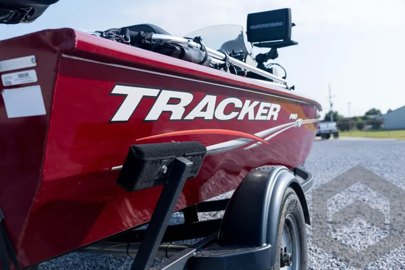 Slide: The Image of 2022 Tracker Pro 170 boat in red on a trailer, featuring a Humminbird device. - 19