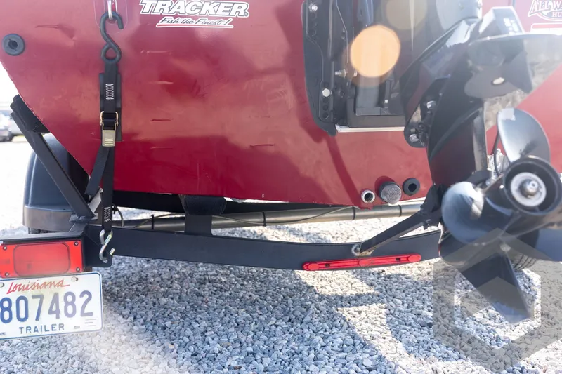 Slide: The Image of Rear view of a 2022 Tracker Pro 170 boat on a trailer, showing propeller and license plate. - 25