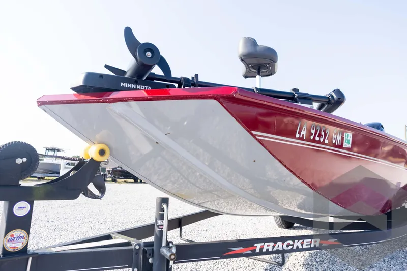 Slide: The Image of 2022 Tracker Pro 170 boat on trailer, featuring Minn Kota motor. - 32