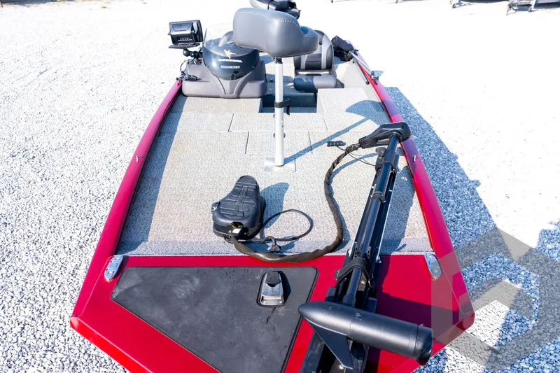 Slide: The Image of 2022 Tracker Pro 170 boat deck with fishing equipment and seating. - 33