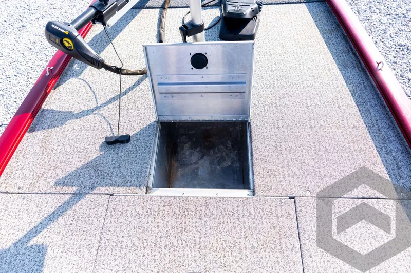 Slide: The Image of 2022 Tracker Pro 170 boat deck with open storage compartment and trolling motor. - 42