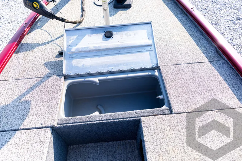 Slide: The Image of 2022 Tracker Pro 170 boat storage compartment with open lid, showcasing interior space. - 43