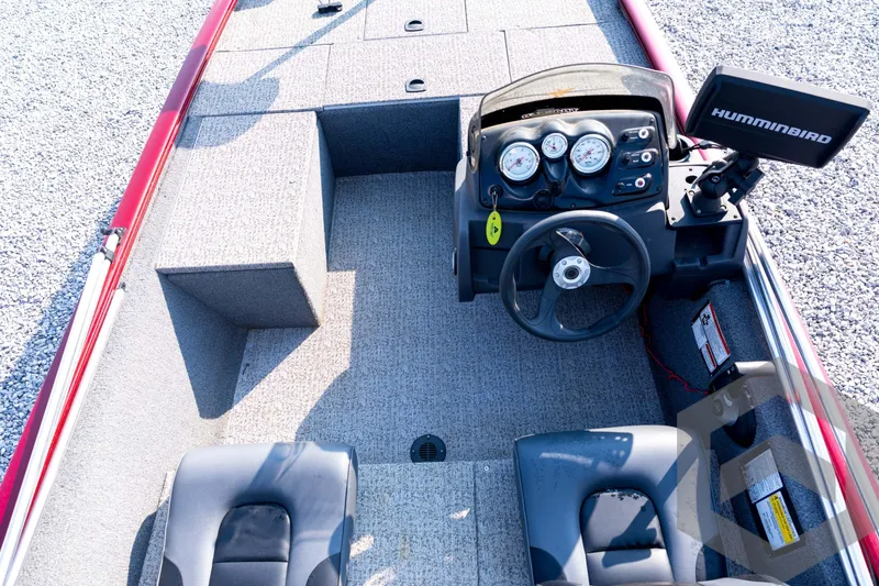 Slide: The Image of 2022 Tracker Pro 170 boat interior with steering console and Humminbird fish finder. - 46