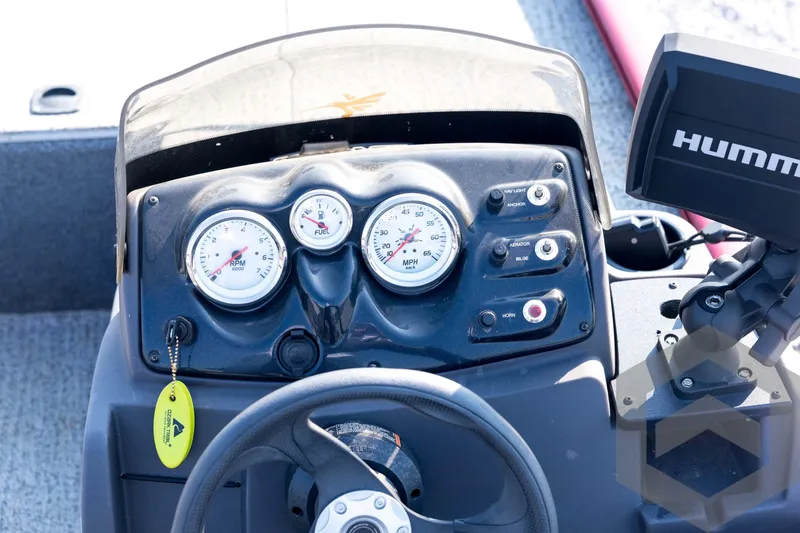 Slide: The Image of Dashboard of 2022 Tracker Pro 170 boat with gauges and controls. - 47