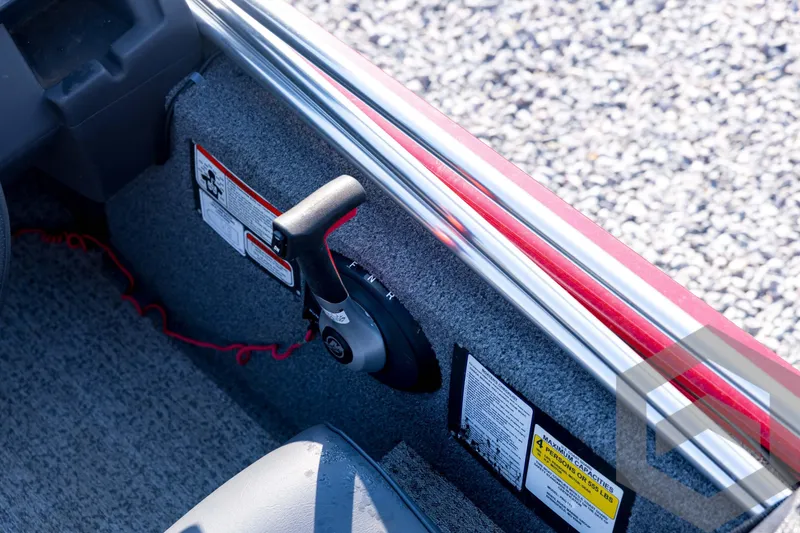 Slide: The Image of 2022 Tracker Pro 170 boat interior with control lever and safety labels. - 48