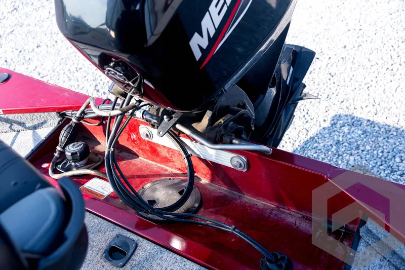 Slide: The Image of 2022 Tracker Pro 170 boat engine and wiring details on red deck. - 55