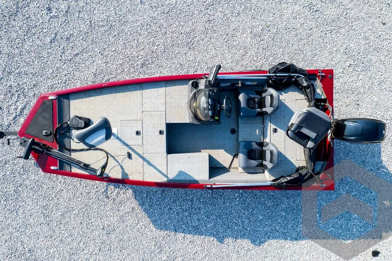 Slide: The Image of 2022 Tracker Pro 170 boat, aerial view, red exterior, dual seats, gravel background. - 58
