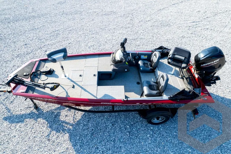 Slide: The Image of 2022 Tracker Pro 170 fishing boat with Mercury engine, red exterior, and spacious seating. - 61