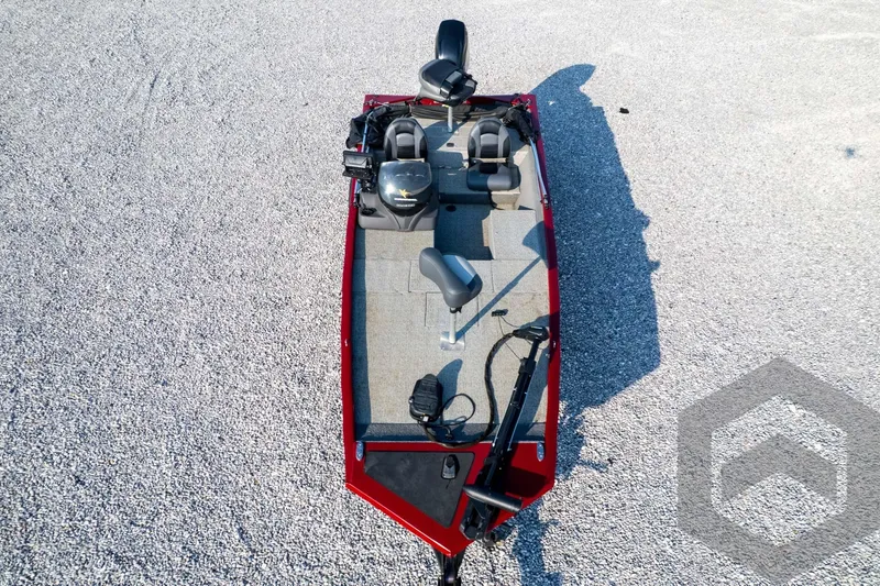 Slide: The Image of 2022 Tracker Pro 170 boat, aerial view, red exterior, gray interior, parked on gravel surface. - 63