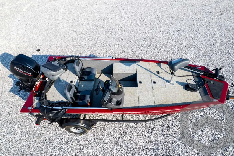 Slide: The Image of 2022 Tracker Pro 170 fishing boat with Mercury engine on gravel surface. - 65