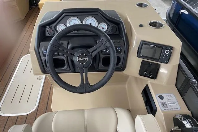 Slide: The Image of 2025 Bentley Pontoons Legacy 223 Swingback dashboard with steering wheel and control panel. - 2