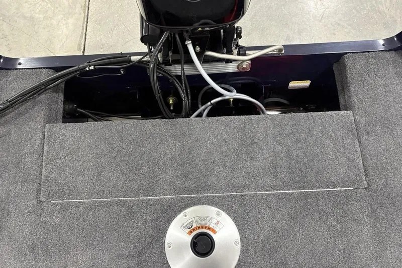 Slide: The Image of 2026 Tracker Super Guide™ V-16 SC boat interior with engine and control panel. - 20