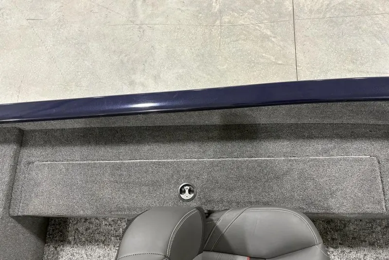 Slide: The Image of 2026 Tracker Super Guide™ V-16 SC interior with gray seating and carpeted flooring. - 23