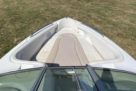 Slide: The Image of 2001 MasterCraft MariStar 230 VRS boat interior with beige seating on grass. - 3