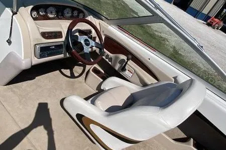 Slide: The Image of 2001 MasterCraft MariStar 230 VRS boat interior with steering wheel and dashboard. - 5