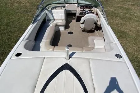 Slide: The Image of 2001 MasterCraft MariStar 230 VRS boat interior with beige seating and steering wheel. - 6