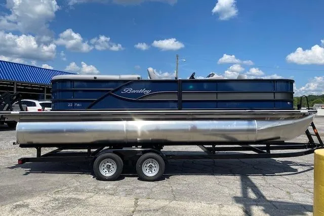 The Image of 2025 Bentley Pontoons Legacy 220 Fish Center Walk Thru on trailer, under blue sky. - 1