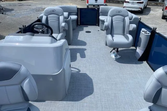 Slide: The Image of 2025 Bentley Pontoons Legacy 220 Fish Center Walk Thru interior with plush seating and steering console. - 4