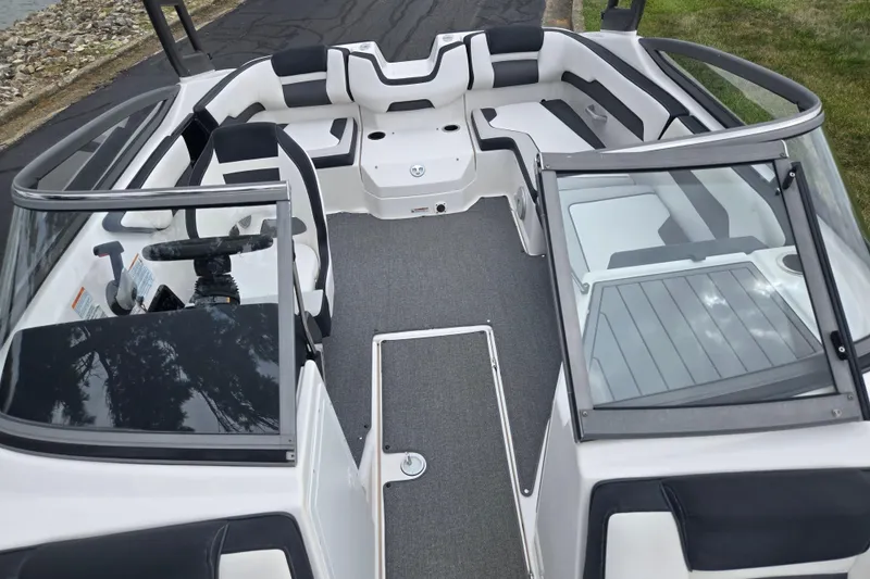 Slide: The Image of 2019 Yamaha Boats AR195 interior with sleek seating and modern dashboard design. - 20