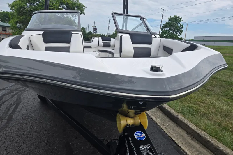 Slide: The Image of 2019 Yamaha Boats AR195 with sleek design and comfortable seating on a trailer. - 6