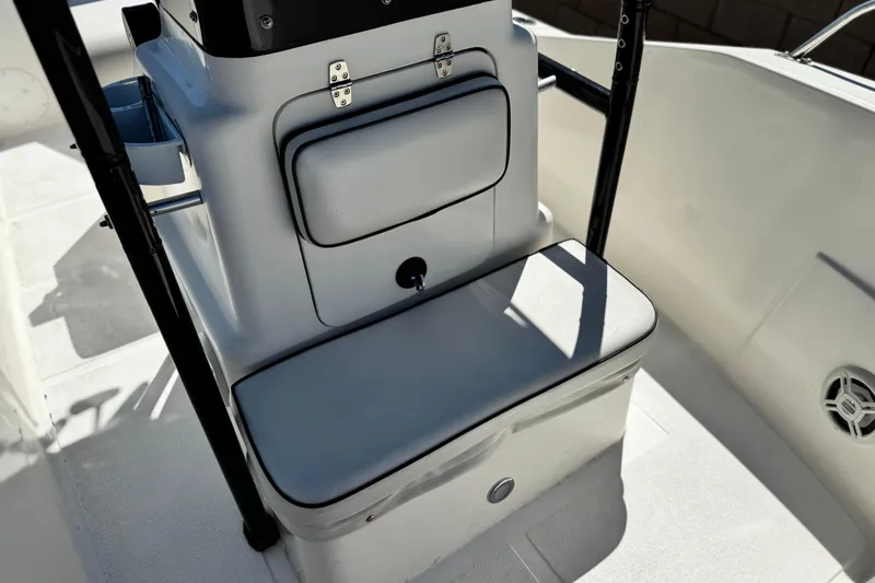 Slide: The Image of 2019 Thresher 19 CC boat interior with cushioned seating and storage compartment. - 10