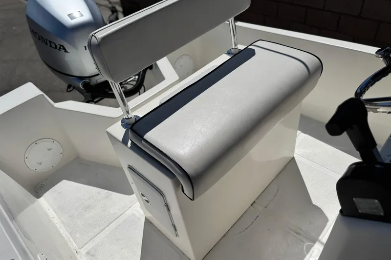 Slide: The Image of 2019 Thresher 19 CC boat interior with Honda outboard motor and cushioned seating. - 14