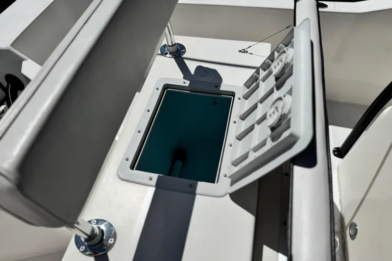 Slide: The Image of 2019 Thresher 19 CC boat interior with open storage compartment. - 15